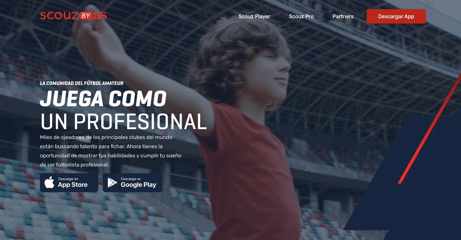 Main hero of the official Scouz by AS website showing a young footballer with arms outstretched in an empty stadium.